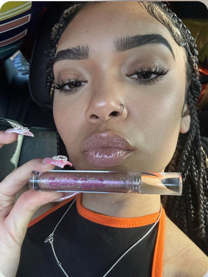 Classic #3 - Glossy Gang Lip GlossClose - up of shimmering glitter gloss applied to lips, showcasing a sparkly, reflective finish."