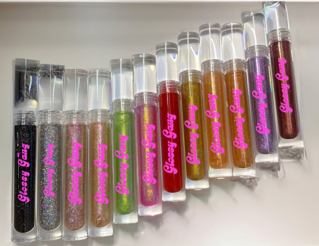 Glamorous Glitter Glossy Collection (box) - Glossy Gang Lip GlossClose - up of shimmering glitter gloss applied to lips, showcasing a sparkly, reflective finish."