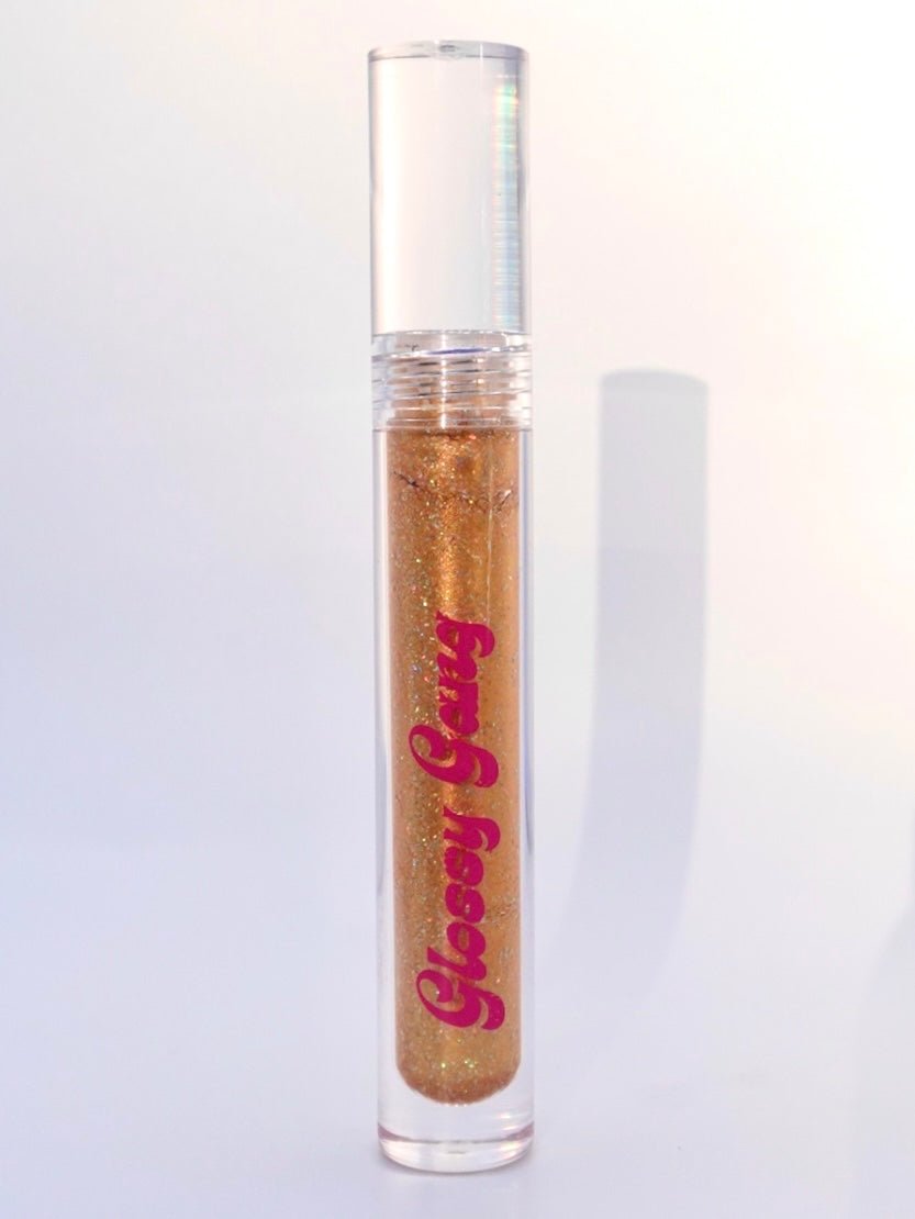 Honey Twist #9 - Glossy Gang Lip GlossClose - up of shimmering glitter gloss applied to lips, showcasing a sparkly, reflective finish."