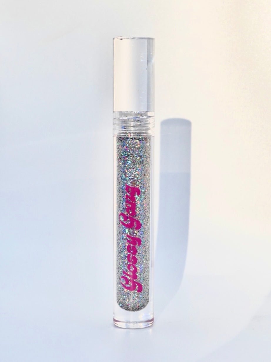 Luxury #2 - Glossy Gang Close - up of shimmering glitter gloss applied to lips, showcasing a sparkly, reflective finish."