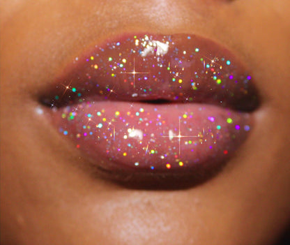 Luxury #2 - Glossy Gang Close - up of shimmering glitter gloss applied to lips, showcasing a sparkly, reflective finish."