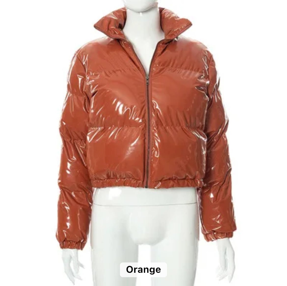 Orange Puffer Jacket (limited edition) - Glossy Gang Close - up of shimmering glitter gloss applied to lips, showcasing a sparkly, reflective finish."