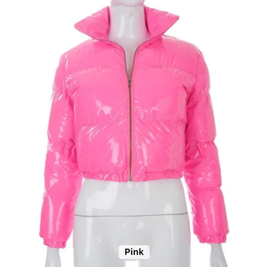 Pink Puffer Jacket (limited edition) - Glossy Gang Close - up of shimmering glitter gloss applied to lips, showcasing a sparkly, reflective finish."