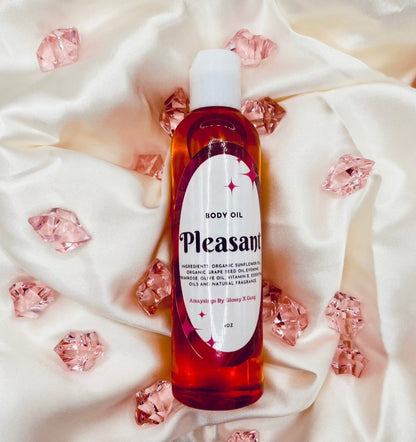 Pleasant (Women's Body Oil) - Glossy Gang Amaysings (Skin Care)Close - up of shimmering glitter gloss applied to lips, showcasing a sparkly, reflective finish."