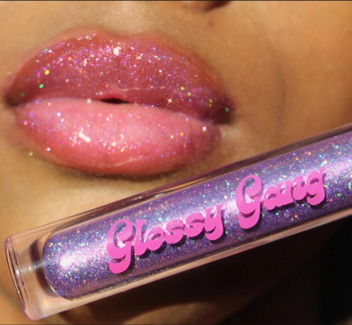 Purple Reign #12 - Glossy Gang Lip GlossClose - up of shimmering glitter gloss applied to lips, showcasing a sparkly, reflective finish."