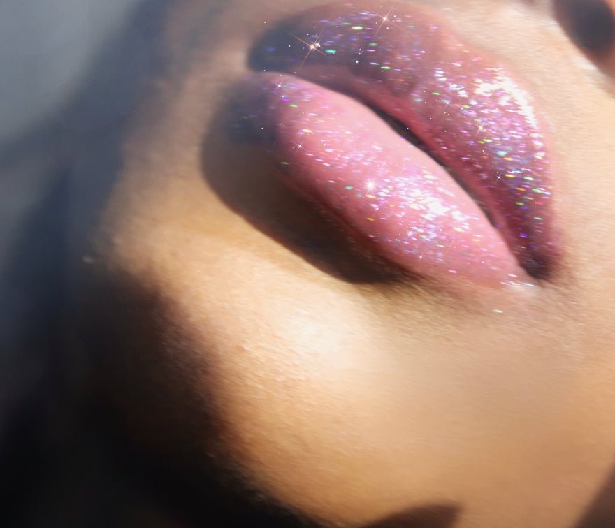 Purple Reign #12 - Glossy Gang Lip GlossClose - up of shimmering glitter gloss applied to lips, showcasing a sparkly, reflective finish."