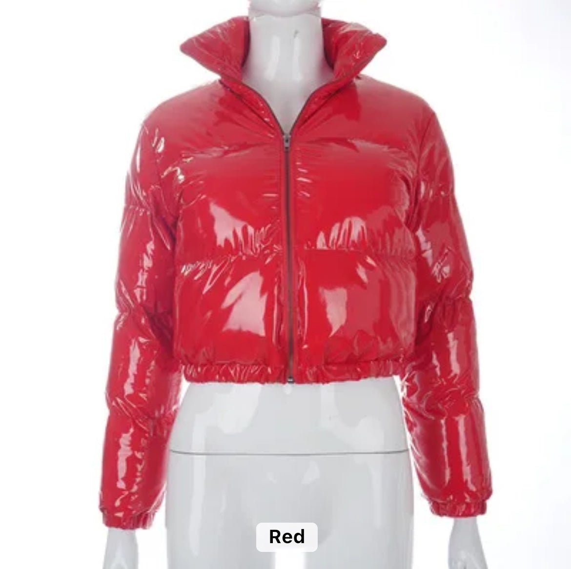 Red puffer Jacket (limited edition) - Glossy Gang Close - up of shimmering glitter gloss applied to lips, showcasing a sparkly, reflective finish."