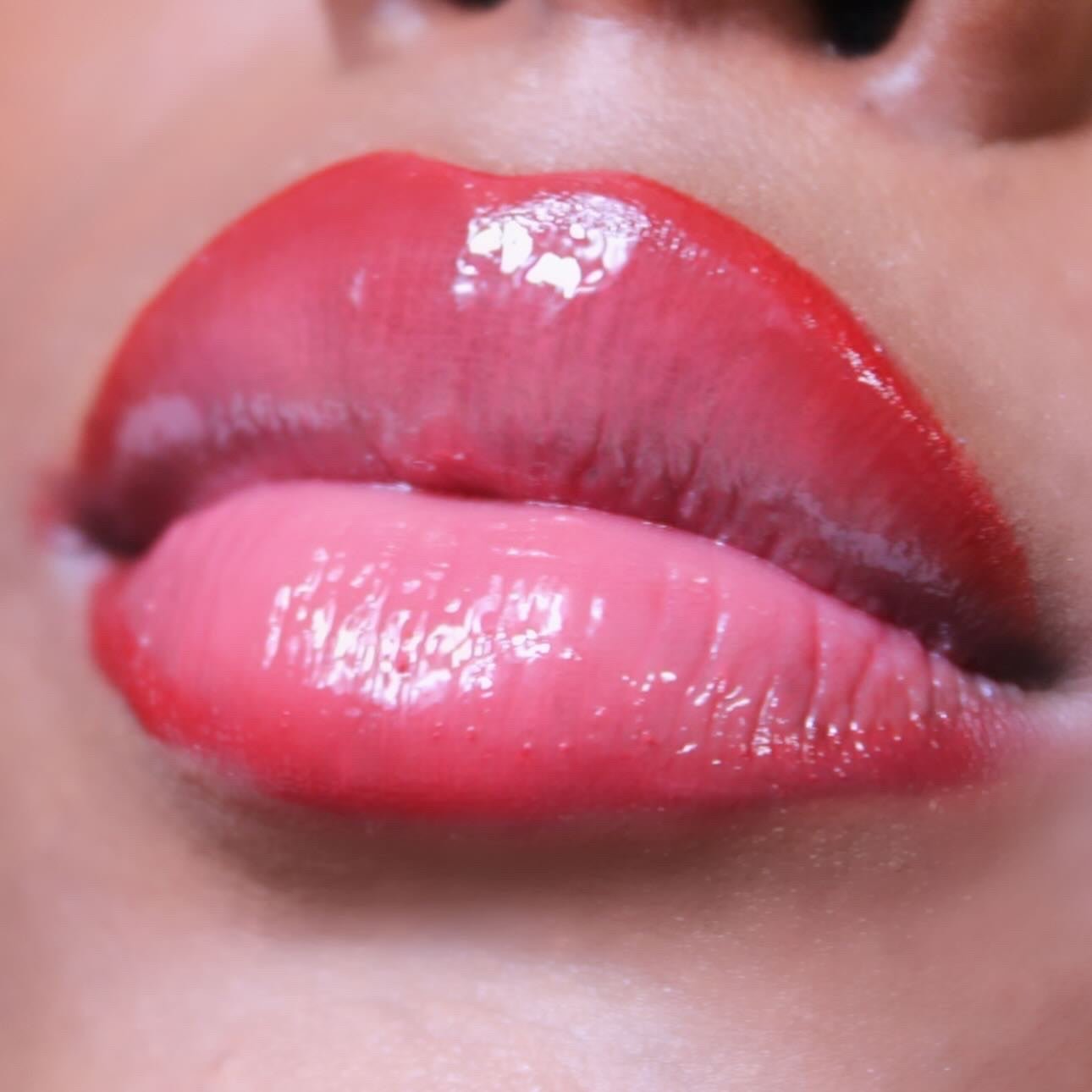 Rosey Red #3 - Glossy Gang Close - up of shimmering glitter gloss applied to lips, showcasing a sparkly, reflective finish."