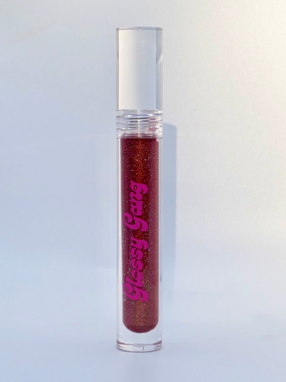 Velvet #13 - Glossy Gang Lip GlossClose - up of shimmering glitter gloss applied to lips, showcasing a sparkly, reflective finish."